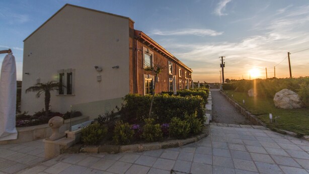 A building with a modern architectural style, featuring a flat facade and large windows. - Palascia Wellness Relais (Otranto)