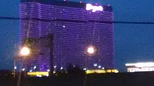 A high-rise building with a prominent sign at the top. - Sunset Inn (Atlantic City)