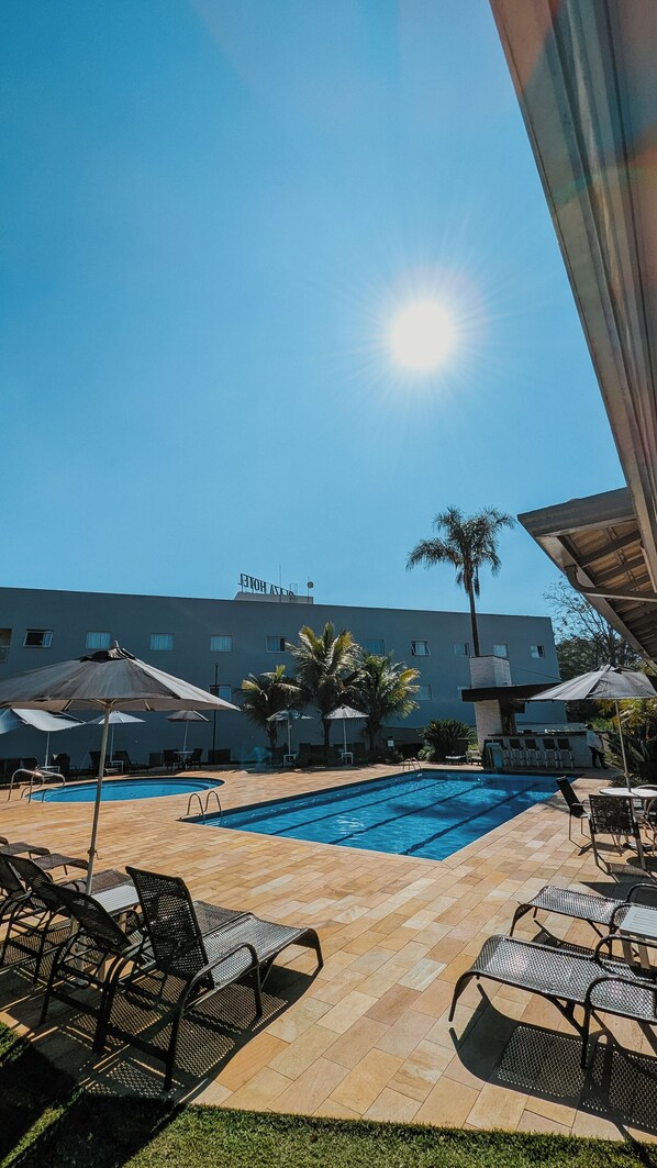 Outdoor pool, pool umbrellas, pool loungers