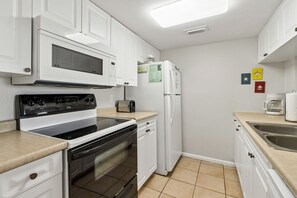 House, 2 Bedrooms | Private kitchen | Full-sized fridge, microwave, oven, stovetop - Relaxed Atmosphere in S Fletcher Duplex by RedAwning (Fernandina Beach)