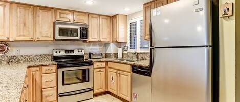 Condo, 2 Bedrooms | Private kitchen | Full-size fridge, microwave, oven, stovetop