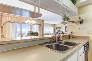 Condo, 2 Bedrooms | Private kitchen | Full-size fridge, microwave, oven, stovetop - Spacious Condo Just Steps from the Atlantic by RedAwning (Fernandina Beach)