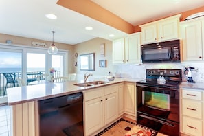 Condo, 2 Bedrooms | Private kitchen | Full-size fridge, microwave, oven, stovetop