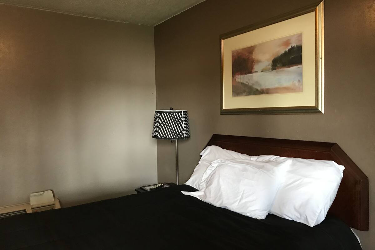 Ropa de cama de alta calidad y tabla de planchar con plancha