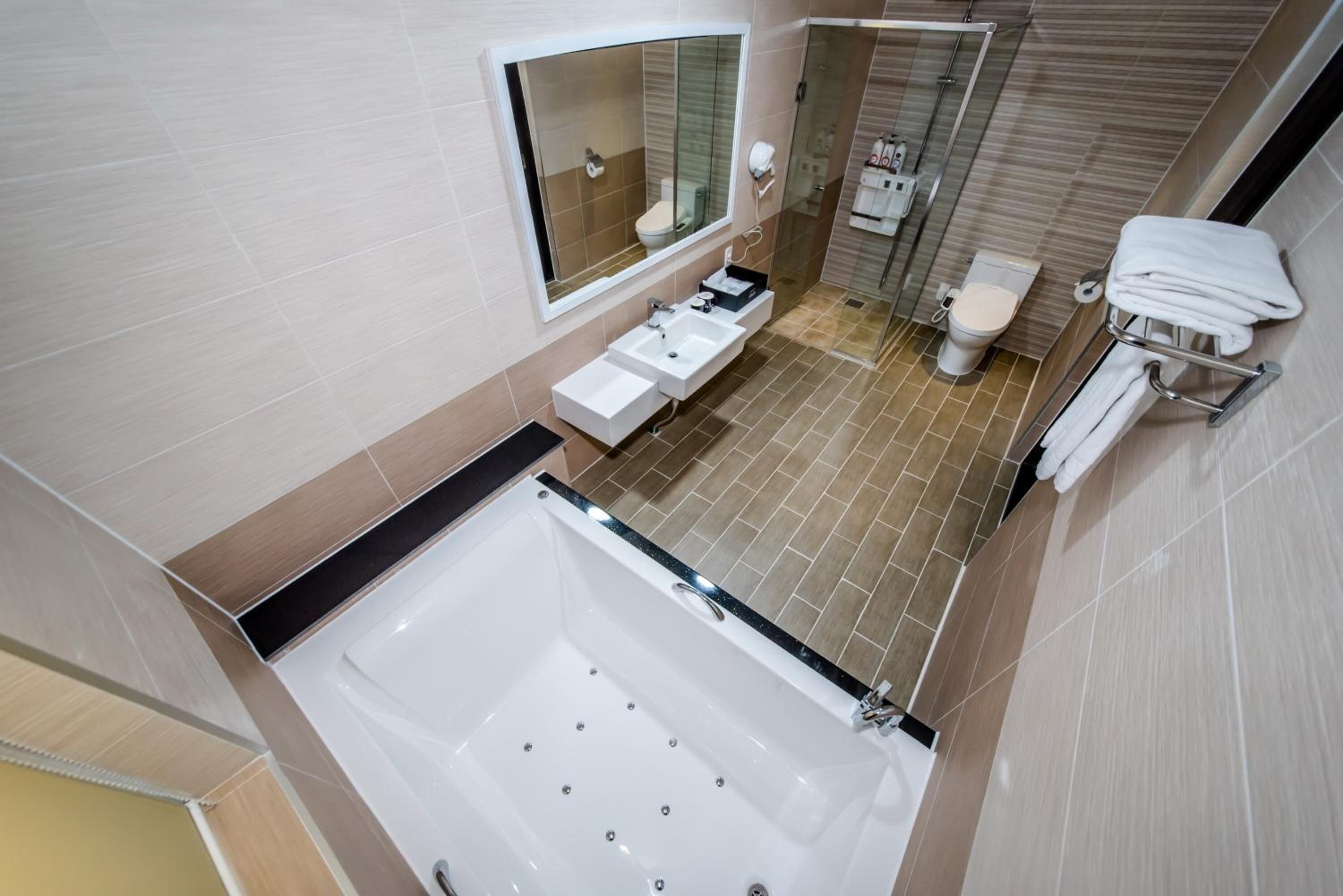 separate bathtub and shower, jetted bath, rainfall showerhead