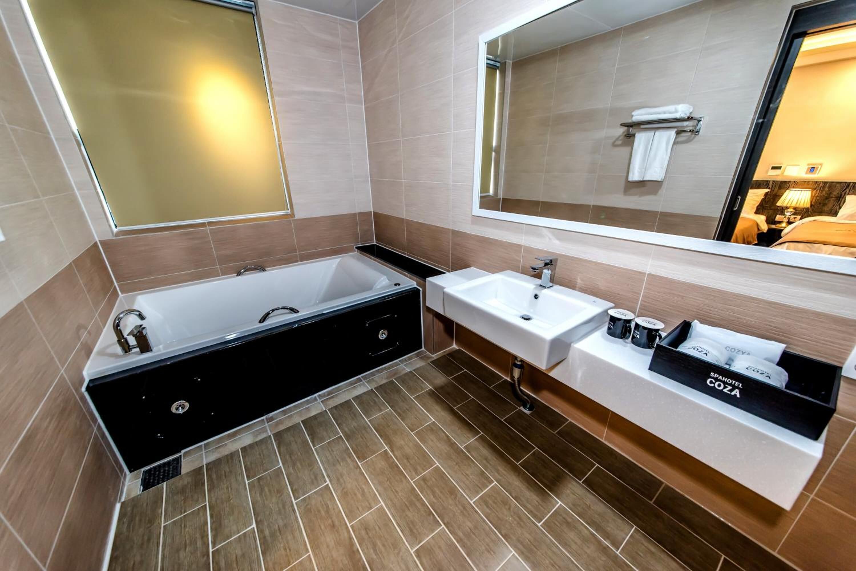 separate bathtub and shower, jetted bath, rainfall showerhead