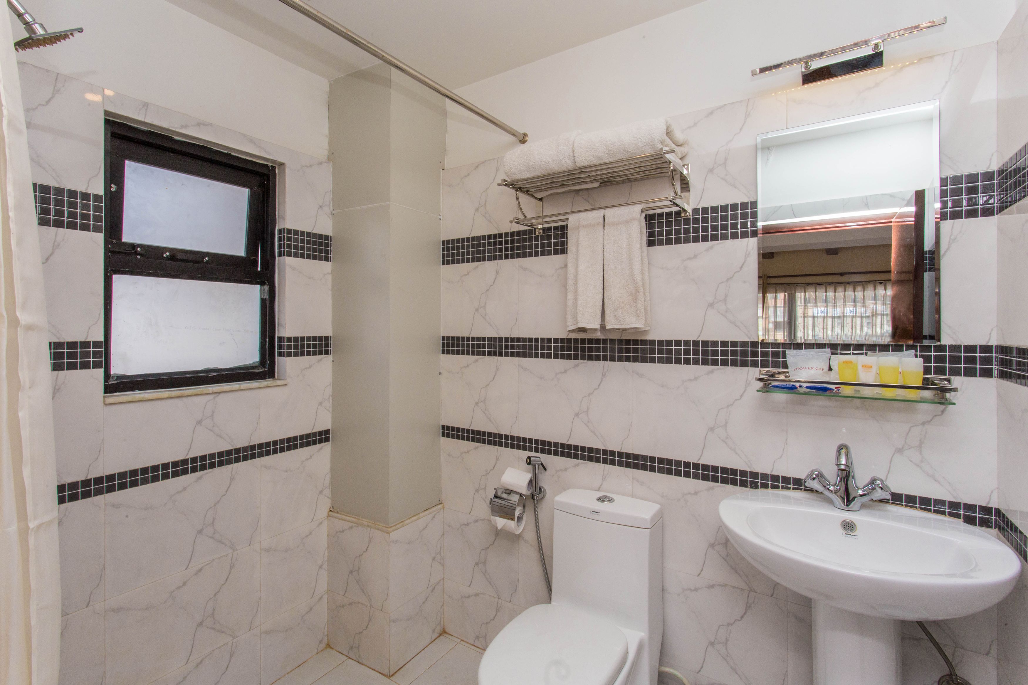 deluxe apartment, 1 bedroom, kitchenette, city view | bathroom | shower, rainfall showerhead, free toiletries, hair dryer