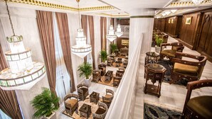 A luxurious hotel lobby with ornate chandeliers, plush seating, and a grand staircase. - AJWA Sultanahmet (Istanbul)