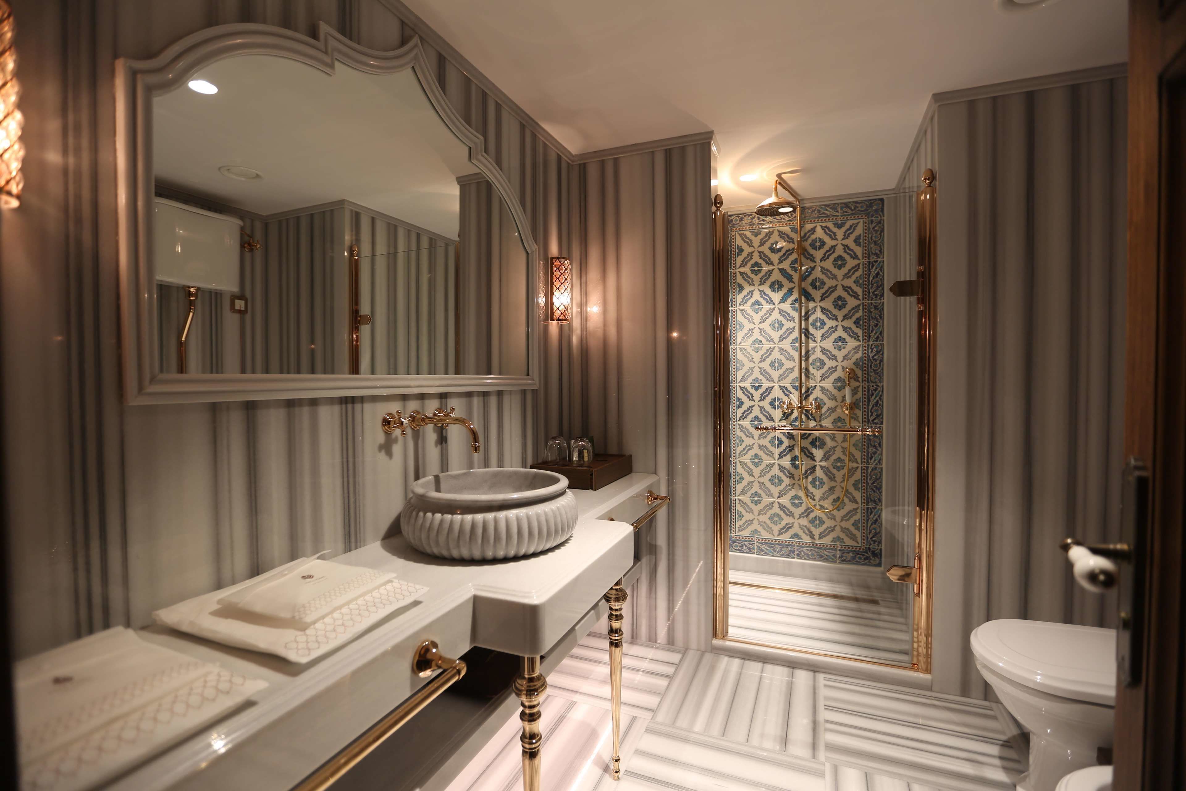 deluxe twin street view | bathroom | designer toiletries, hair dryer, bathrobes, slippers