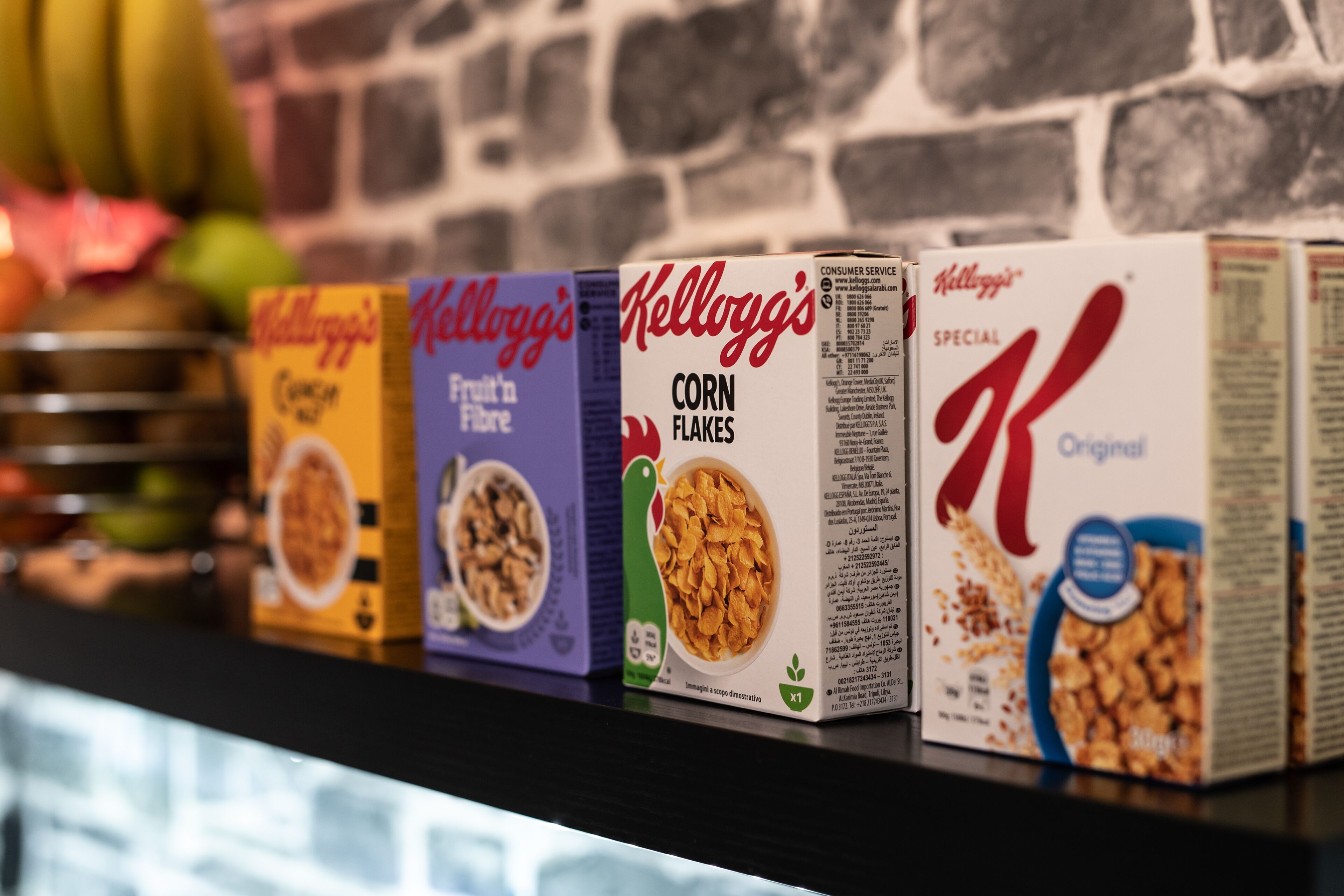 Cereal boxes on a shelf.