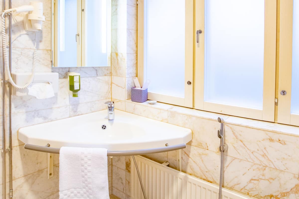 superior room | bathroom | shower, hair dryer, towels, soap