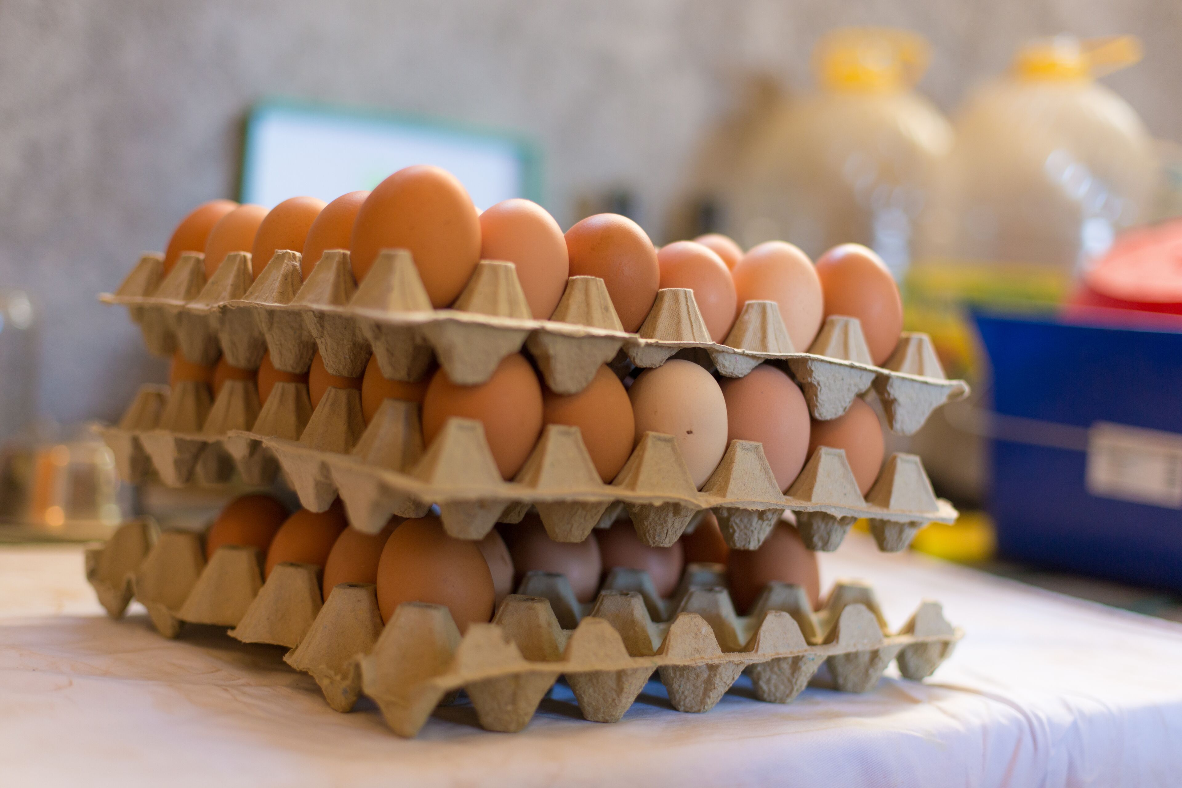 A carton of eggs on a table.