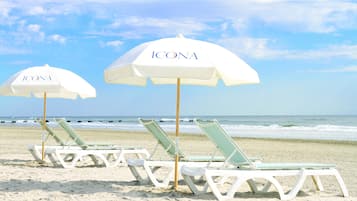 On the beach, sun-loungers, beach umbrellas, beach towels