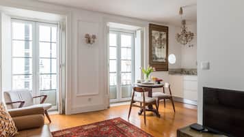 Apartment, 1 Bedroom, Balcony | Living area | Flat-screen TV