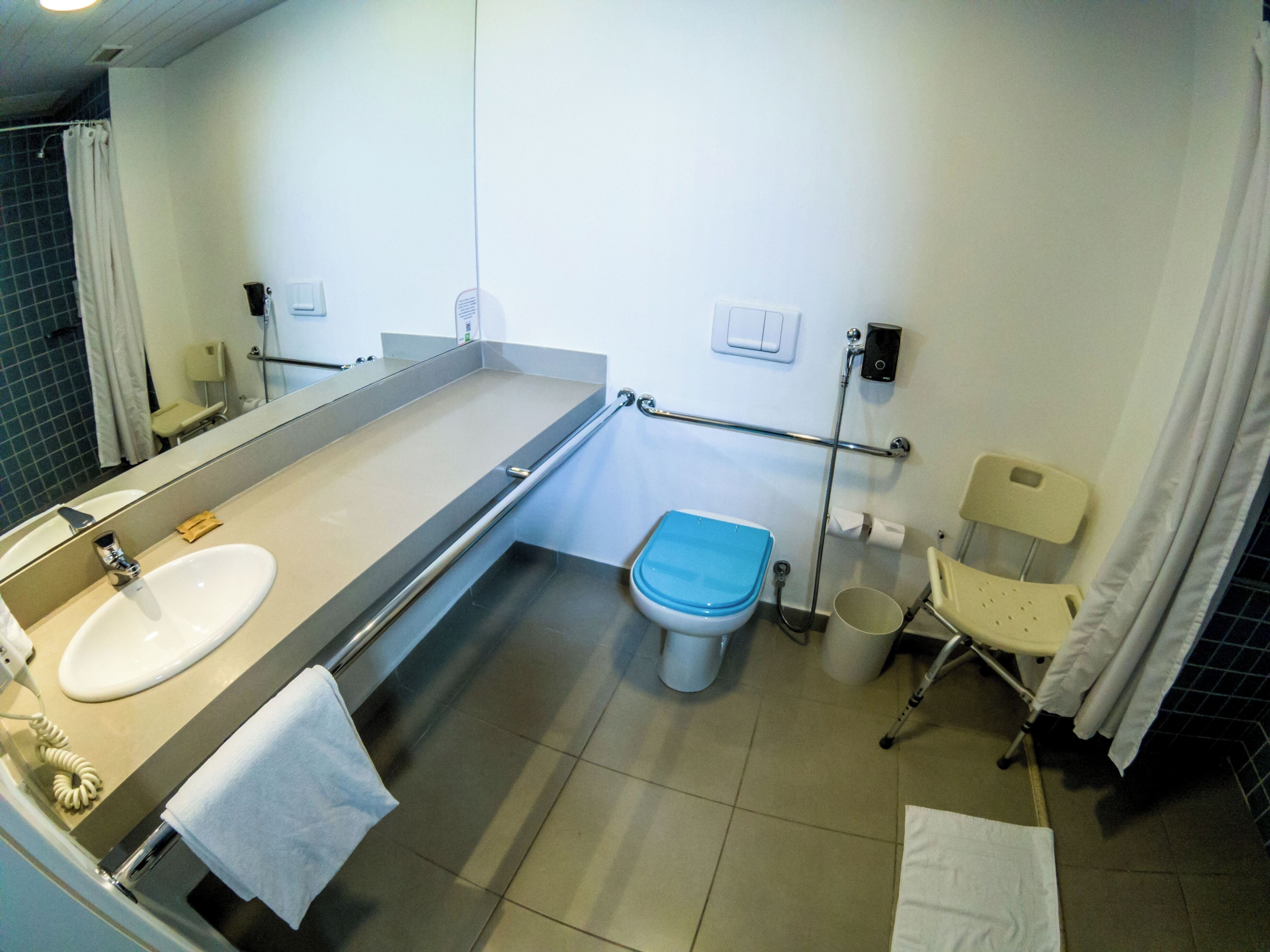 room adapted for people with reduced mobility | bathroom | shower, eco-friendly toiletries, hair dryer, towels