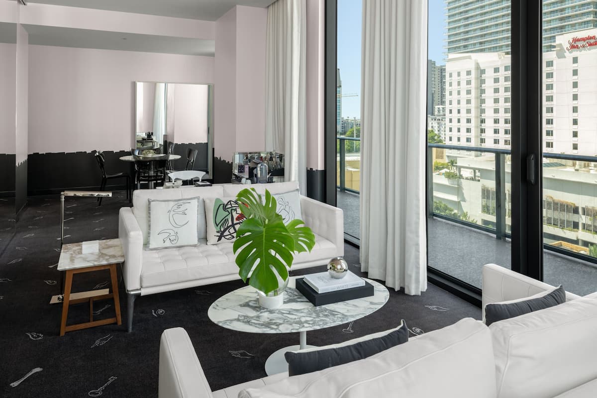 Signature Suite, 1 King Bed, Non Smoking, City View (Balcony) | Living area | Flat-screen TV, pay movies