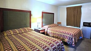 A hotel room with two beds, a desk, a lamp, a television, and a window with curtains. - Budget Lodge by OYO Portland West (Portland)