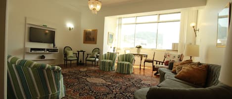 Standard Room, 3 Bedrooms | Living room | Flat-screen TV, DVD player