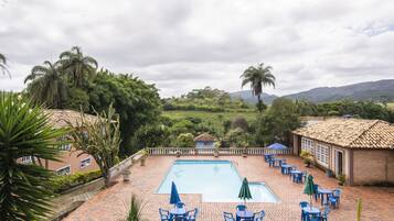 Outdoor pool, pool umbrellas, pool loungers