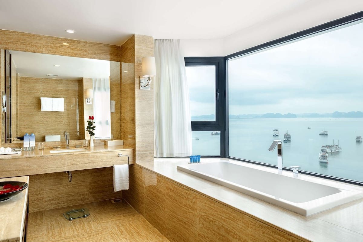 junior suite, 1 king bed, smoking | in-room safe, desk, laptop workspace, soundproofing