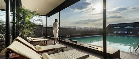 Seasonal outdoor pool, open 9:00 AM to 9:30 PM, pool umbrellas