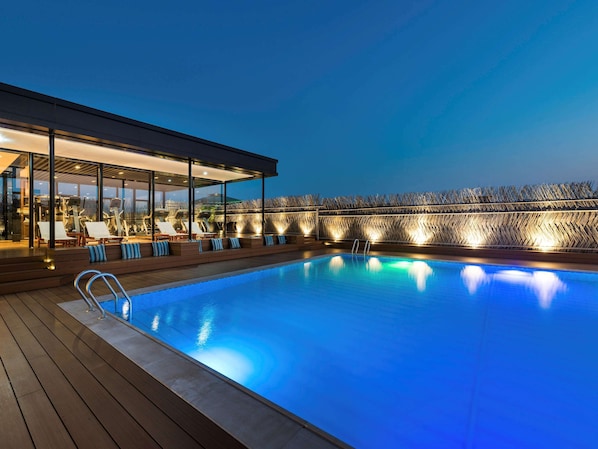 Seasonal outdoor pool, open 9:00 AM to 9:30 PM, pool umbrellas