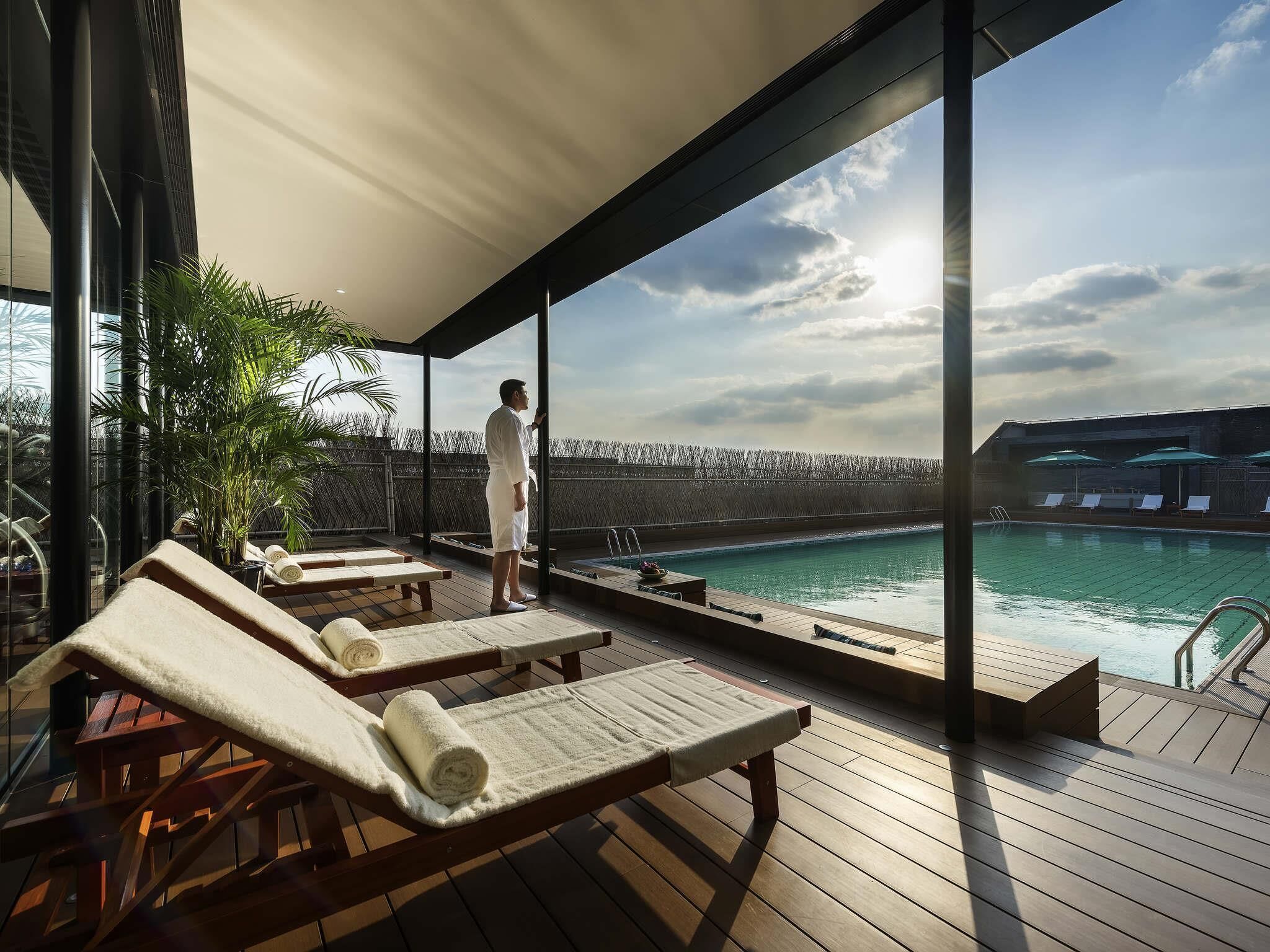 Seasonal outdoor pool, open 9:00 AM to 9:30 PM, pool umbrellas