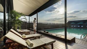 Seasonal outdoor pool, open 9:00 AM to 9:30 PM, pool umbrellas