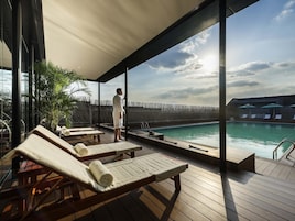 Seasonal outdoor pool, open 9:00 AM to 9:30 PM, pool umbrellas