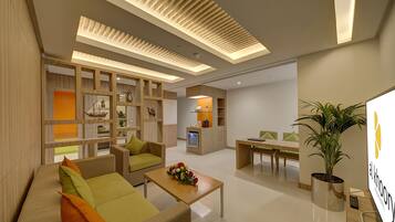 Executive Suite, 1 King Bed | Living room | 22-inch LED TV with satellite channels, TV