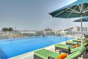 Outdoor pool, open 8:00 AM to 8:00 PM, pool umbrellas, sun loungers