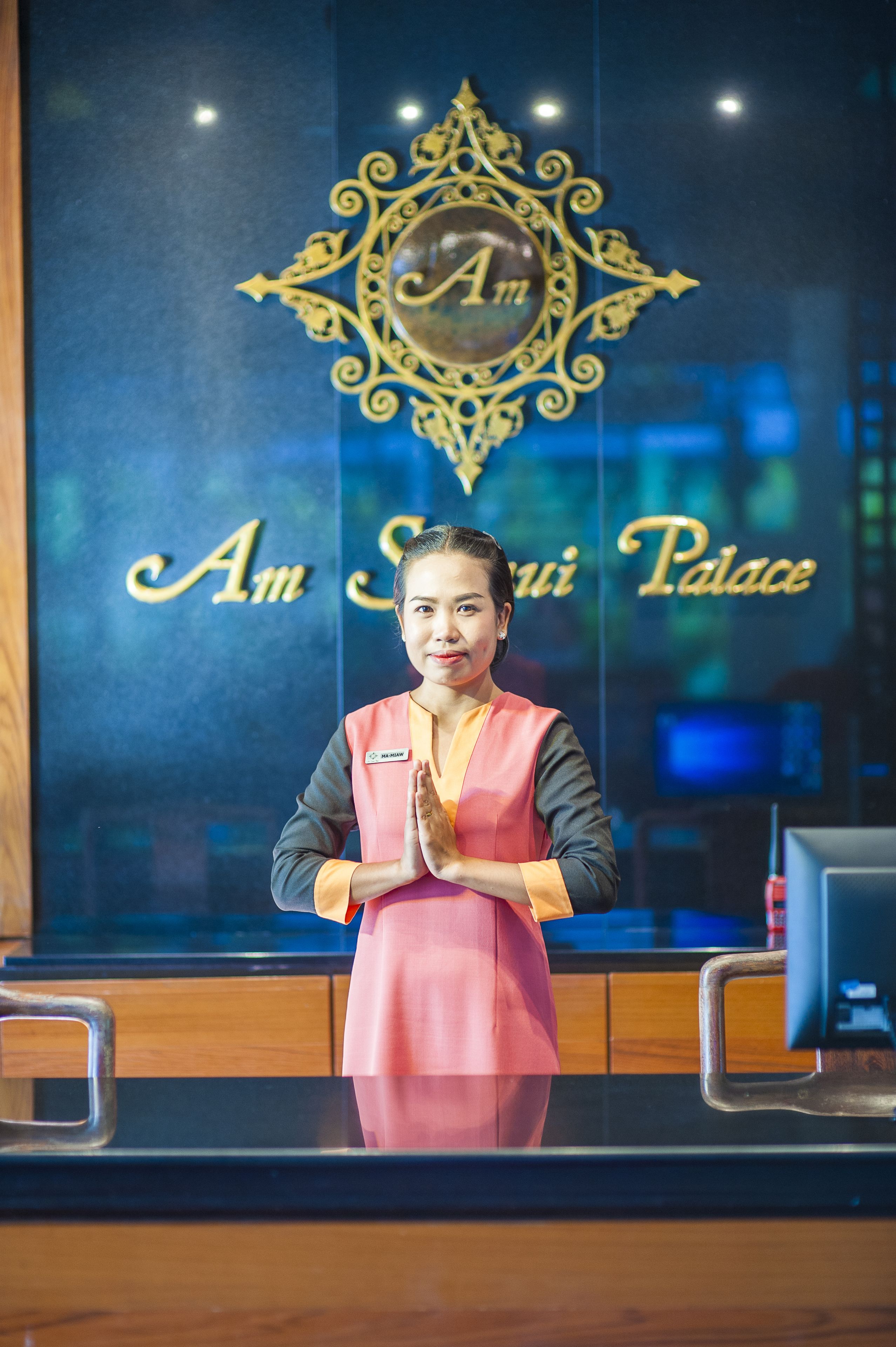 A reception area with a decorative emblem and the words "Am" and "Palace" visible.