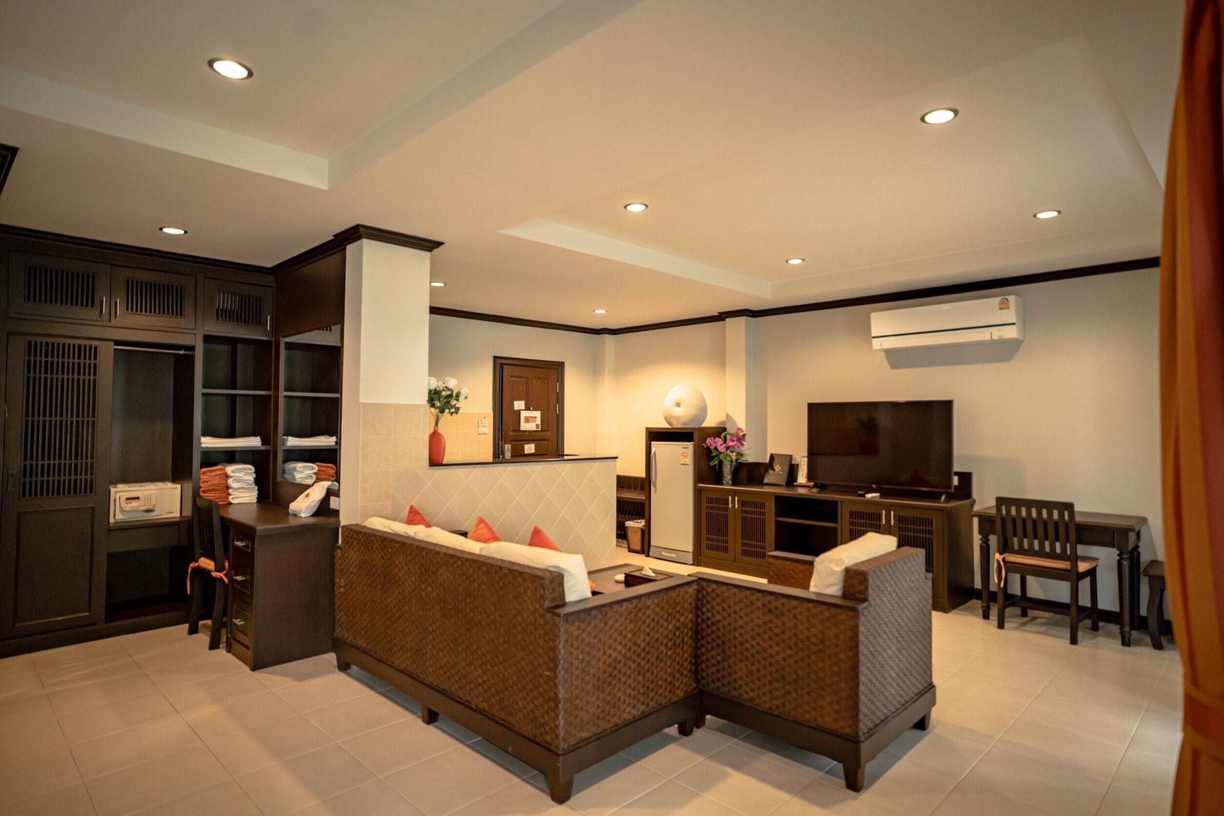 triple suite room | living area | led tv