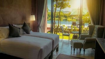 Deluxe River View Room | Premium bedding, minibar, desk, laptop workspace