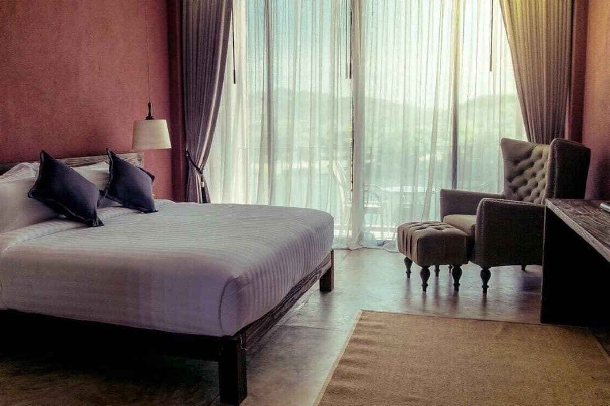 deluxe river view room with bathtub | premium bedding, minibar, desk, laptop workspace