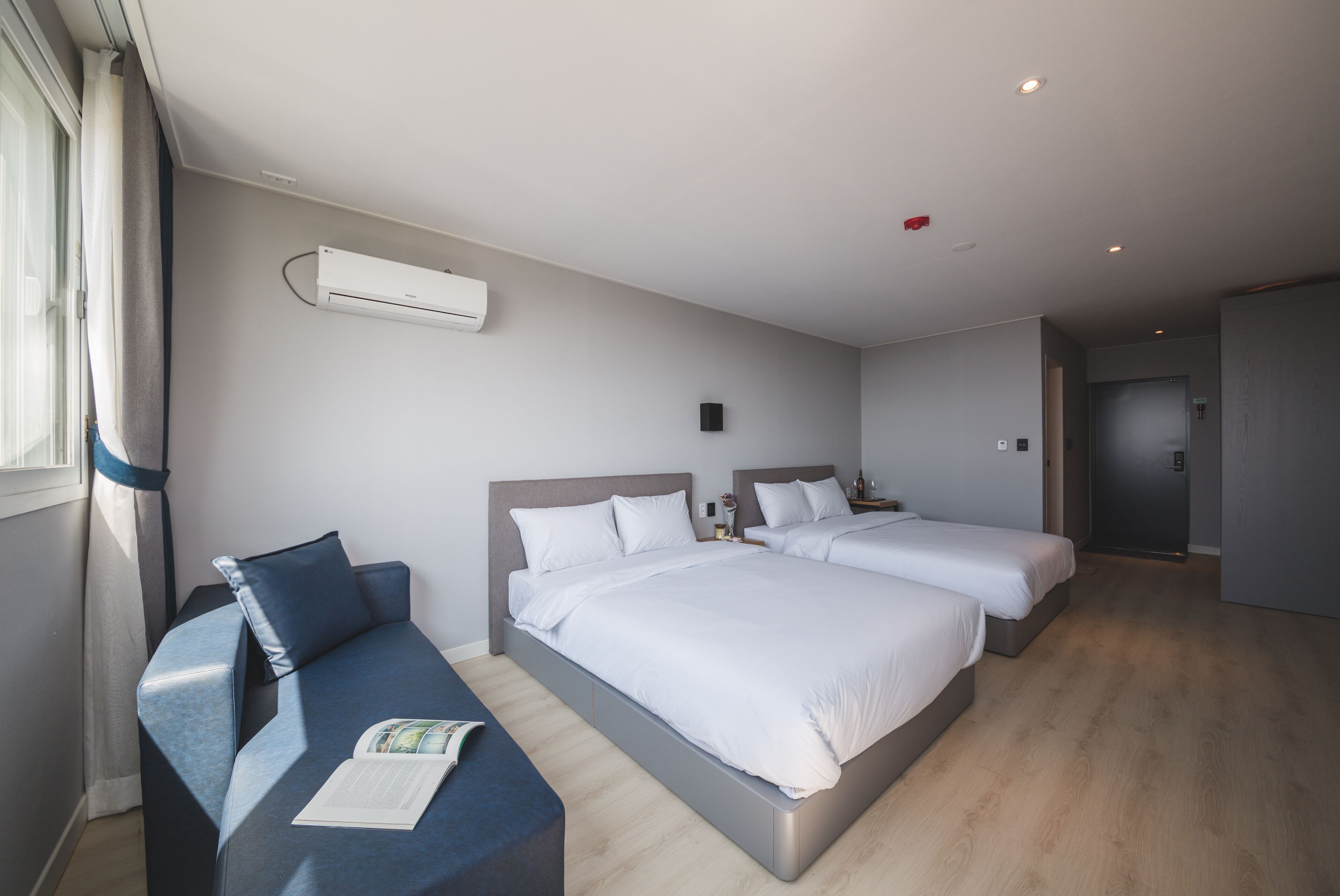 deluxe room, 2 double beds, non smoking, sea view | 1 bedroom, down duvets, desk, blackout curtains