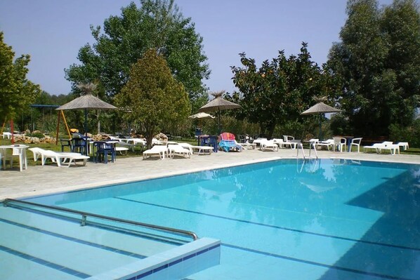 Outdoor pool, pool umbrellas, pool loungers