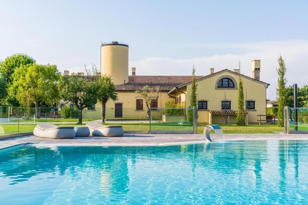 Outdoor pool, a waterfall pool, sun loungers