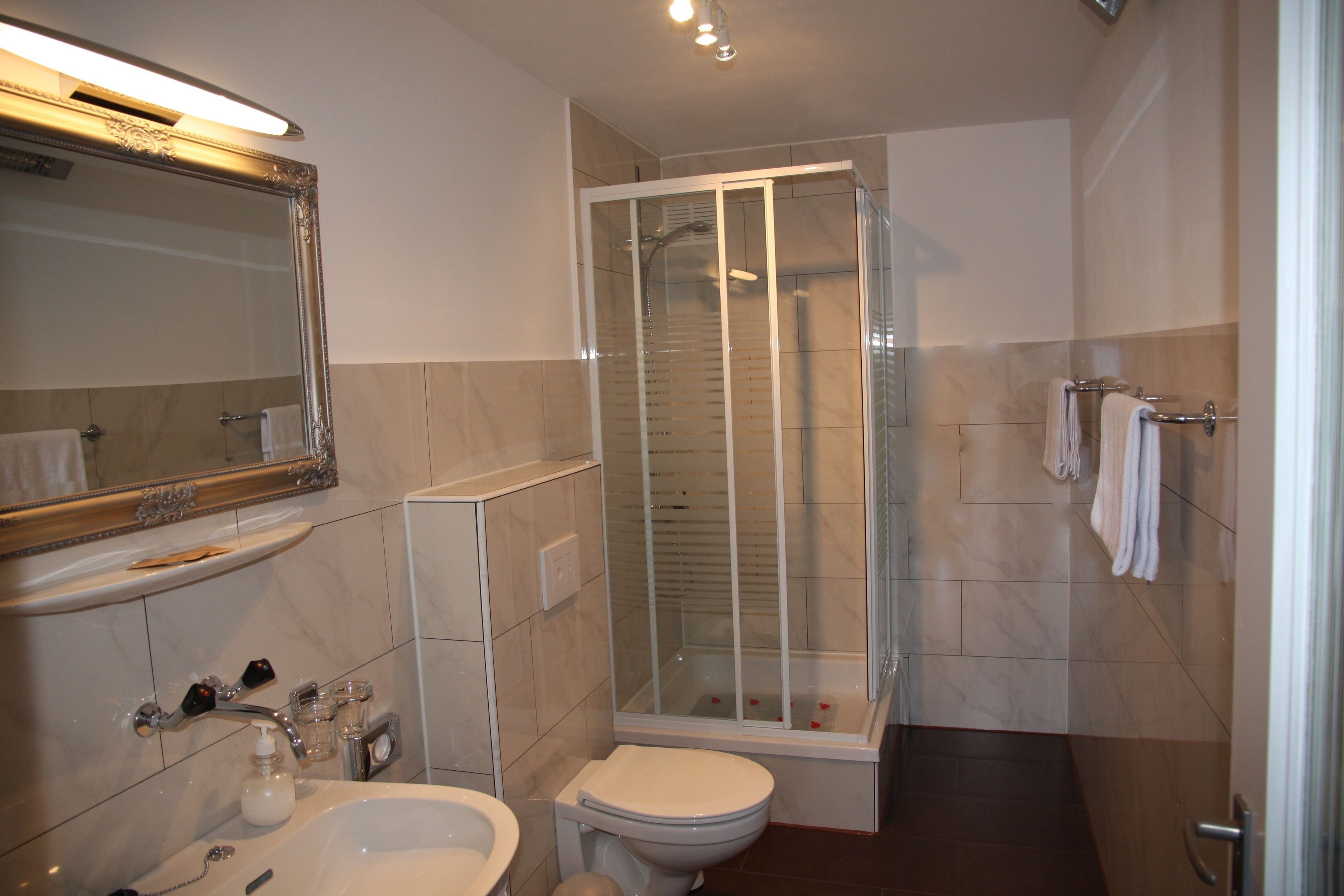 triple room, lake view | bathroom | shower, rainfall showerhead, free toiletries, towels