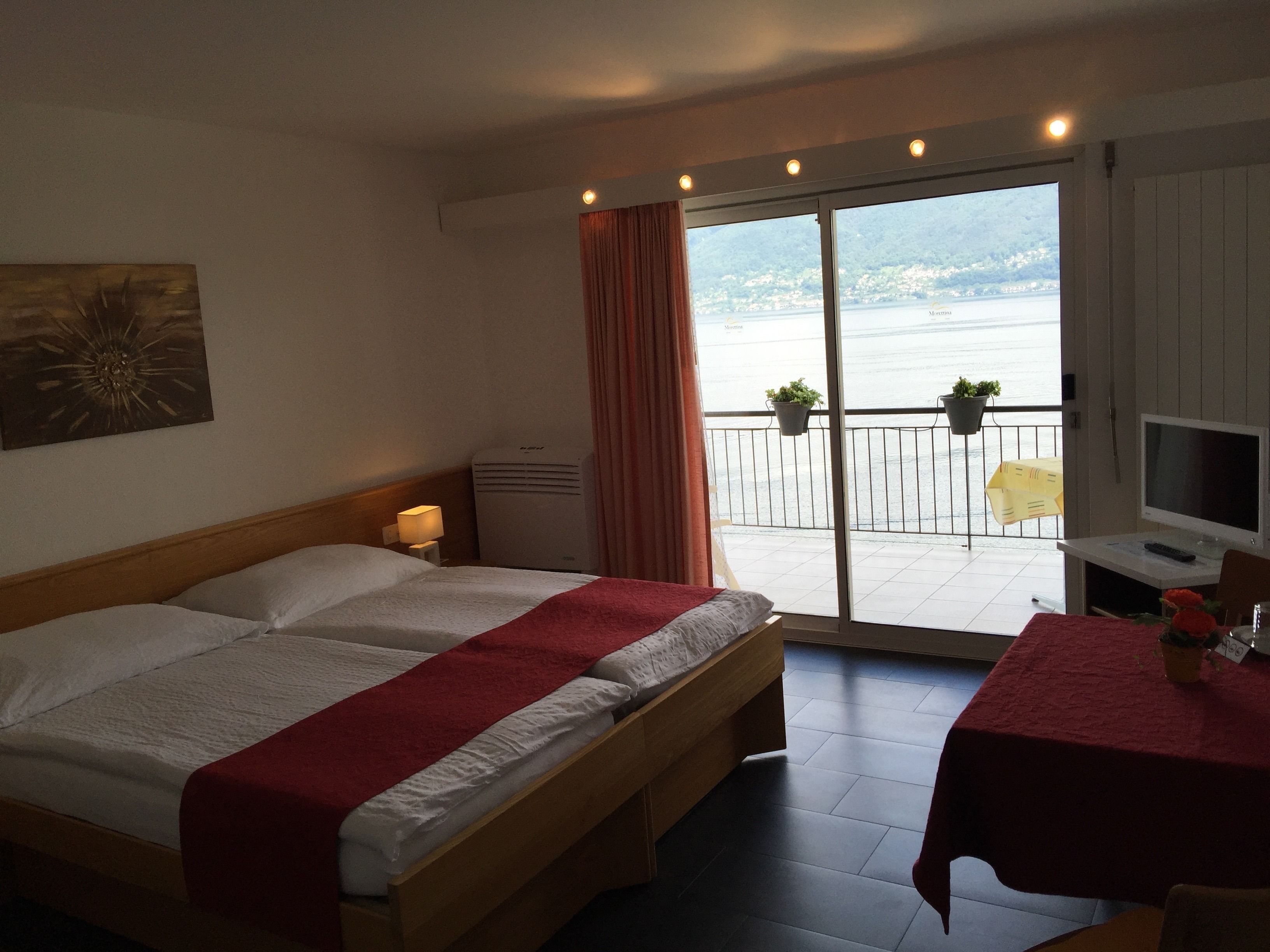 classic double room, lake view | 1 bedroom, in-room safe, free cots/infant beds, rollaway beds