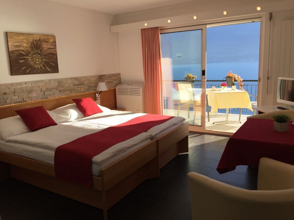 classic double room, lake view | 1 bedroom, in-room safe, free cots/infant beds, rollaway beds