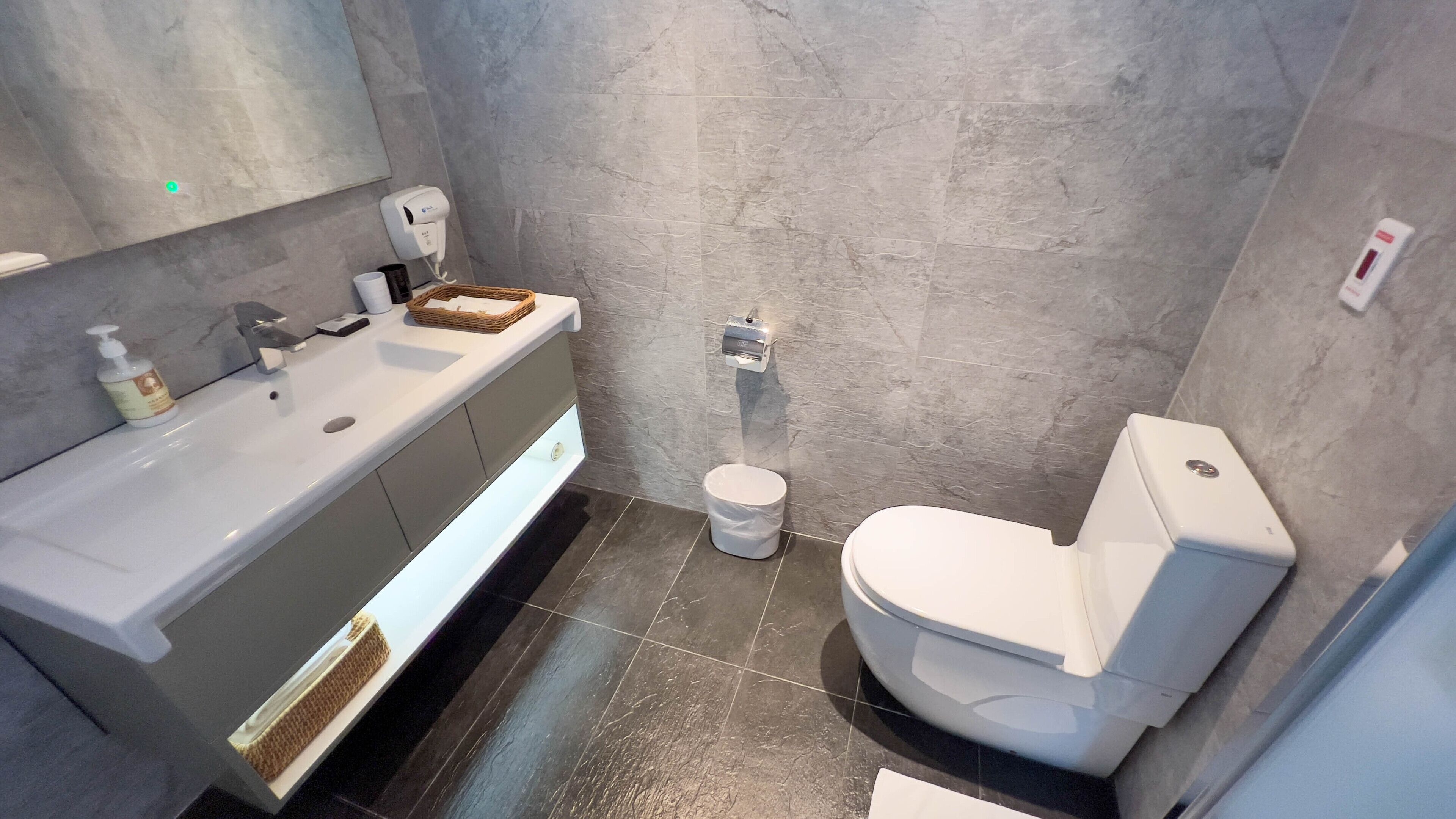 shower, hair dryer, slippers, towels