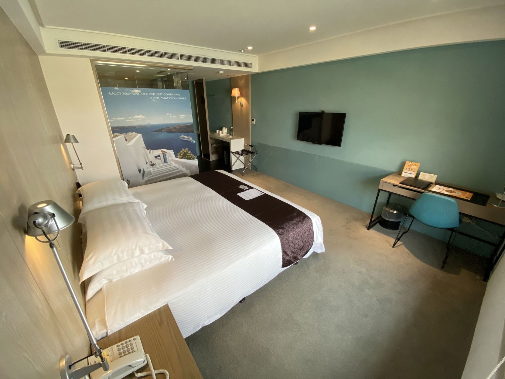 Premium bedding, desk, laptop workspace, blackout drapes