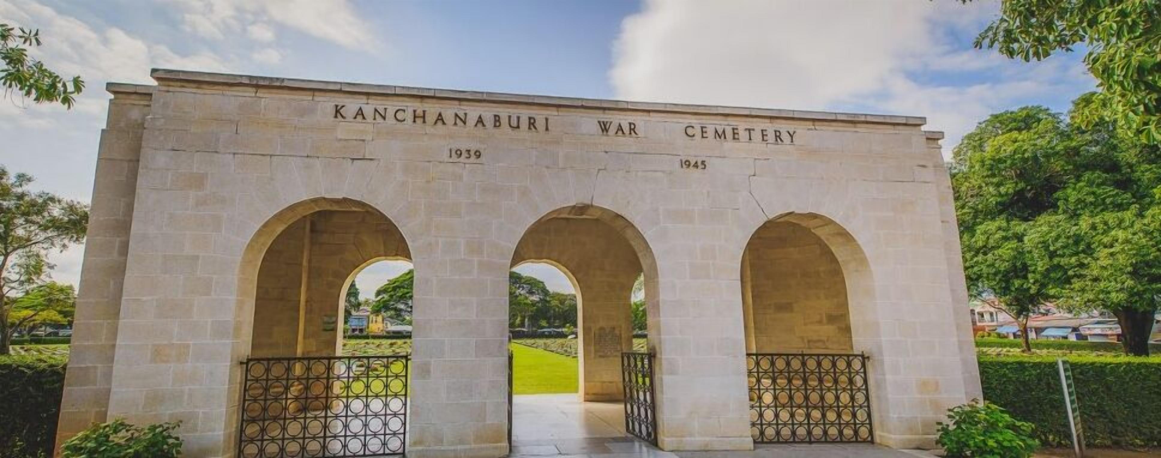 A stone monument with the inscription "KANCHANABURI WAR CEMETERY" and dates "1939" and "1945".