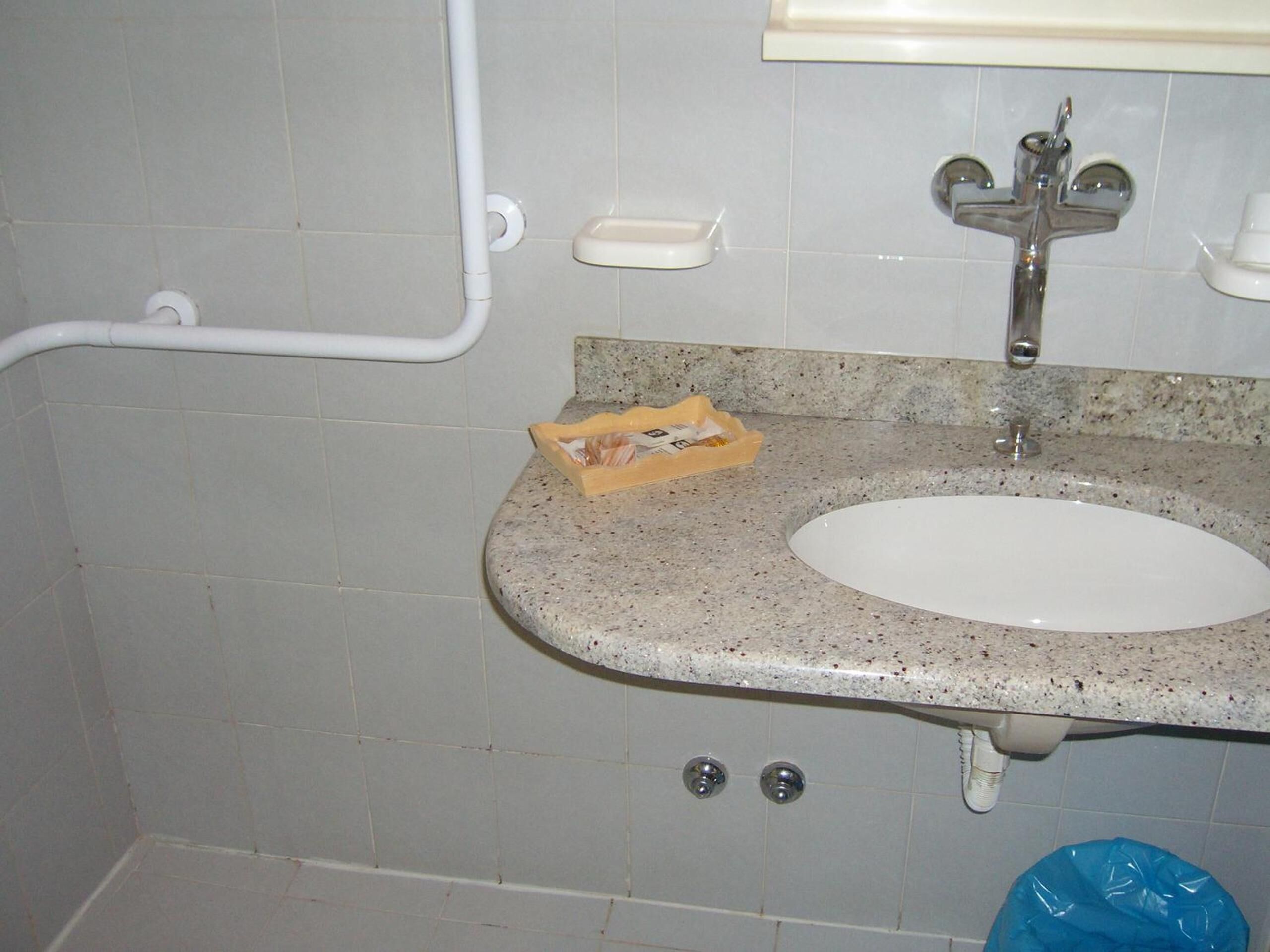 shower, hair dryer, slippers, towels