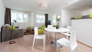 Family Apartment, 1 Bedroom, Kitchen | Living area | Flat-screen TV - Ténéo Apparthotel Talence - Arthéna (Talence)