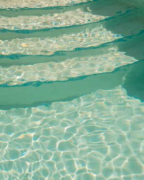 A close-up of clear, shallow water with visible ripples and reflections. - Klinci Village Resort  (Klinci)