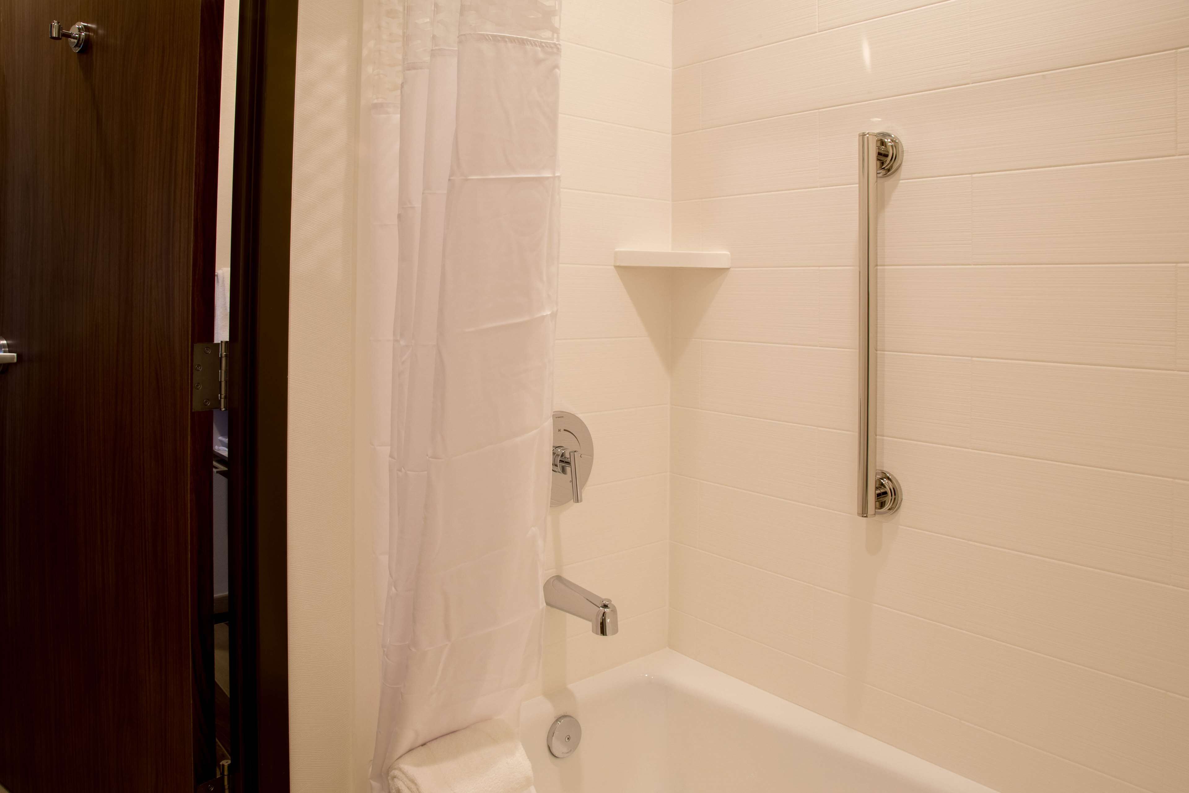 A bathroom with a bathtub, a shower, and a toilet.