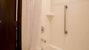 A bathroom with a bathtub, a shower, and a toilet.