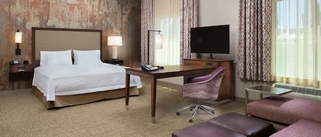 Hypo-allergenic bedding, desk, laptop workspace, blackout drapes